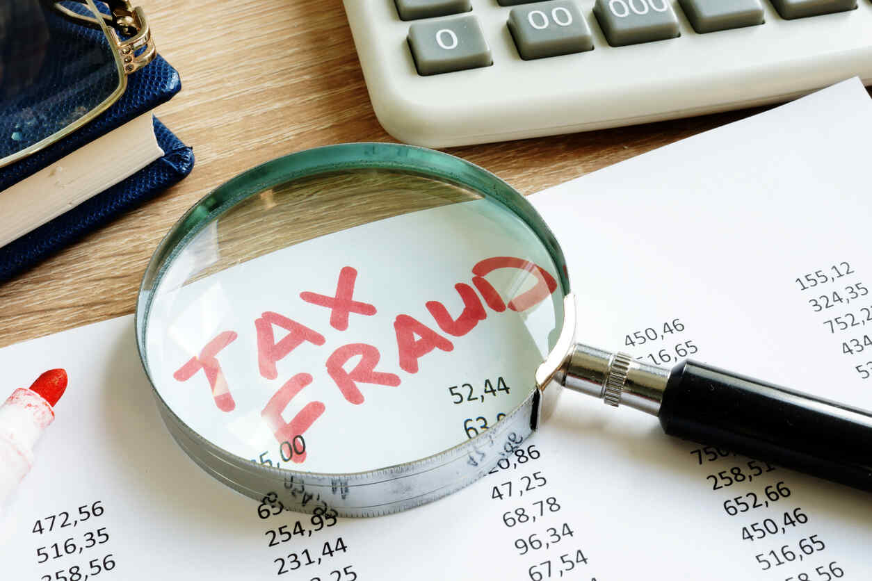 Magnifying glass over a financial document highlighting 